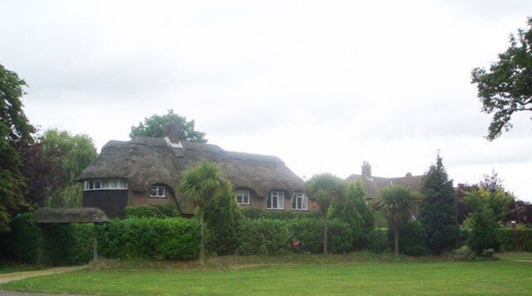 Thorpe End Garden Village Thorpe End was developed in the 1930s as a "Garden Village" by Percy and Leonard Howes of the Norwich estate agents Percy Howes and Co, who saw a potential market in the provision of new middle class houses, within easy commuting distance of the city, but in rural surroundings, and bought a site of 90 acres in open country straddling the Plumstead Road. Their brochure offered the ideal home at Thorpe End - house designs were not stipulated, but they had to be designed and built under the supervision of members of the Royal Institute of British Architects. The use of mellow bricks and thatched roofs was encouraged to lend the development an old-world character. The houses were to be built at a density of no more than three to the acre, all gardens having room for a tennis court, a quintessential thirties middle-class aspiration. Although later development has diluted these high ideals, much of the Garden Village has survived. This house, on the north east side of the central green, was occupied by Leonard Howes himself, and is one of the largest and most eleborately picturesque in the development.