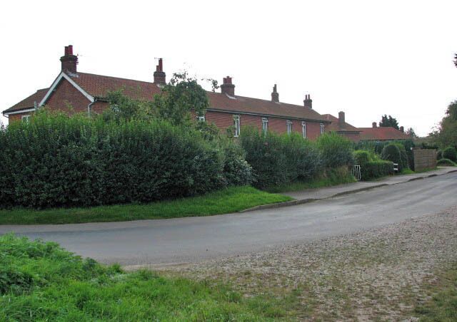 Terraced cottages on The Street. Across the road from the village hall > 986130.