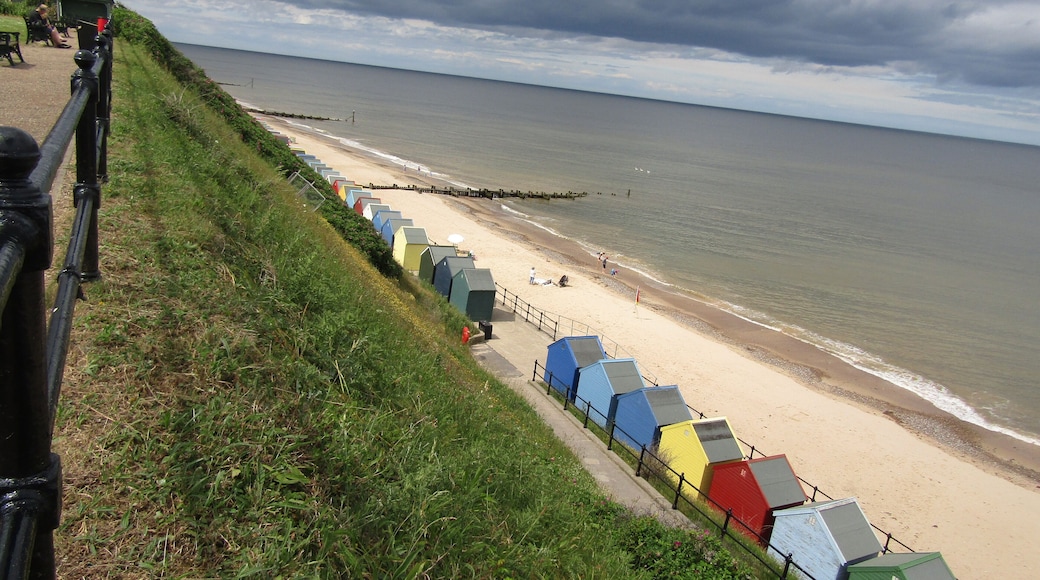 Looking north west along the promenade and Mundesley beach in the village of Mundesley, Norfolk, United Kingdom.