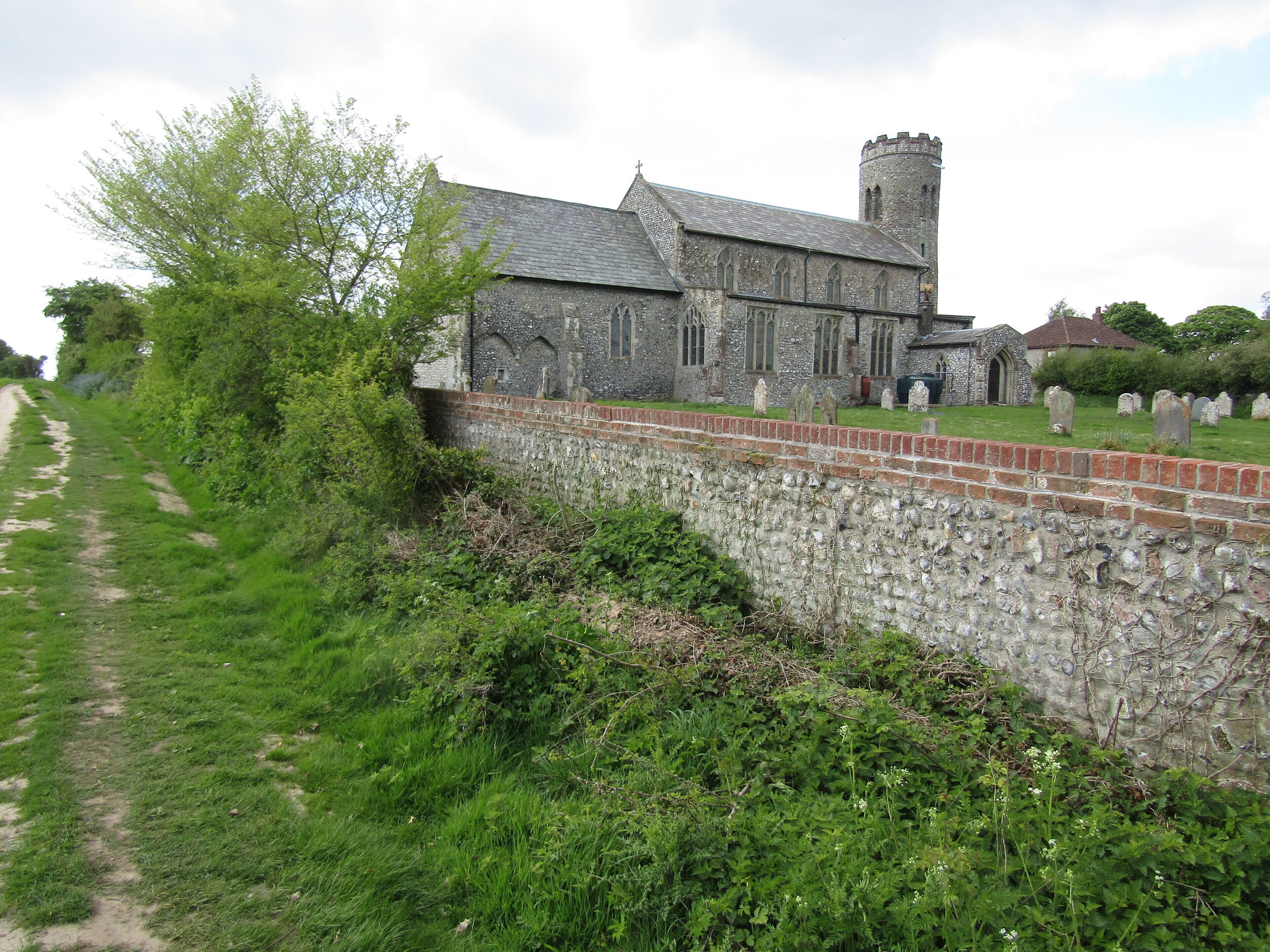 The north facing elevation of the parish church of Saint Mary in the village of Roughton, Norfolk, England.