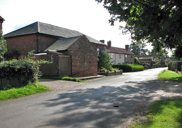 View south along The Street The red-brick building seen at left is the Wesleyan Reformed Church (built in 1829).