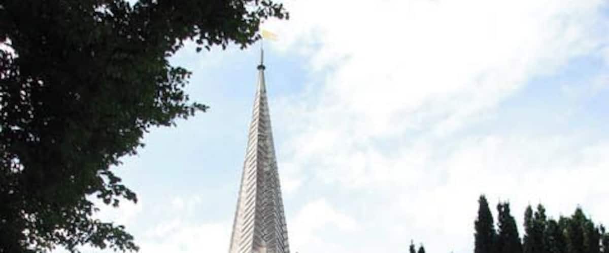 St Mary's church - tower and porch. St Mary's church > 1408886 - 1408907 as we see it today was mainly built during the 14th century. It is a large church with a square tower that is topped by a lead-covered spire. St Mary's was extensively restored by the then Rector, the Revd J.G. Fardell, in the late 19th century and the furnishings and stained glass windows as well as the ornate font cover date from this time. The nave roof > 1408947 has massive barn-like timbers, tie-beams and kingposts which all appear to be original as is the C14 octagonal font > 1408954. Another survival is the so-called Bardolph Effigy > 1408950 - a knight in armour who rests in a recess built into the north nave wall. Unusually, the statue is of carved oak, painted black presumably in the 19th century in order to resemble stone. According to tradition it depicts Sir Hugh Bardolph who was Lord of Greys Manor in the 12th century. The east window contains glass made by J.R. Clayton in 1857 > 1408914 while he was working with Powell & Sons of London. The north aisle east window > 1408916 is by the same stained glass artist and was made to designs by Henry Holiday. The glass on the south wall > 1408935 believed to be the rarest of the church, is thought to date from the 16th century, a time from which very little remains. 17th century Flemish glass > 1408932 can be found in one of the nave north windows and one of the north chancel windows were made by the well-known London glass maker C.E. Kempe > 1408930.