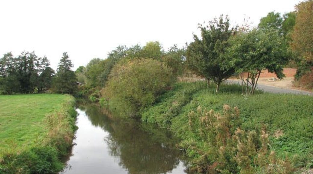 View south-west (upstream) along the River Tas. The River Tas rises near Carlton Fen (near New Buckenham) and then flows northwards for approximately 20 miles before joining the River Yare at Trowse - just south of Norwich. The Tas valley contains many interesting historical sites including an Iron Age hill fort > 1355699 at Tasburgh, the old Roman settlement of Venta Icenorum > 1352695 - now Caistor St Edmund - and the site of a woodhenge > 1391552 at Arminghall. During Roman times, the river was an important resource for the people of Venta Icenorum. Over the centuries, the Tas has also been visited by two of England's finest poets: William Wordsworth in 1790, and Philip Larkin.