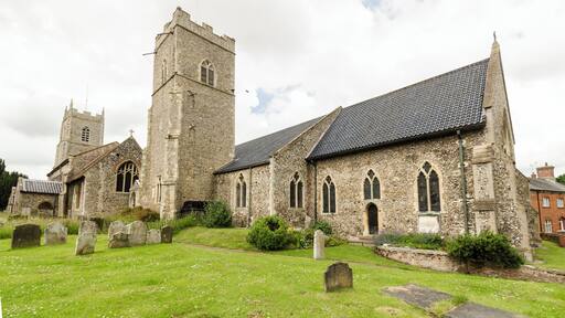 Reepham once had three churches almost touching each other, and two still stand. The main church is Saint Mary's, attached to this is St Michael's. The third church, All Saints' Hackford, was destroyed by fire in 1543 and the remnants mostly demolished in 1796. There is a small portion of the porch still extant opposite St Michael's tower. St Michael's church was the parish church of Whitwell until 1935 when the three parishes were amalgamated. It is now mainly used as a church hall. It has a tall west tower, nave, south porch and chancel which is linked to St Mary's church via a passageway. The tower is of two stages with battlements and pinnacles. Most of the church dates from the 14th and 15th century and has been recently converted into a church hall. At the east end there is a stained-glass window by Reginald Frampton. Saint Mary's church is a Grade I listed church dating from the 14th century, with a major restoration done in 1885. It is built of flint with a black pantile roof. There is a nave, north aisle, south porch, south tower (offset from the nave), south aisle and chancel. The clerestory was removed and the nave roof rebuilt circa 1790. The north arcade dates from the 14th century and has four bays with octagonal piers. The south arcade dates from the 13th century and also has four bays. The chancel was rebuilt during the Victorian restoration. On the north wall there is a monument probably to Roger de Kerdiston, died 1337. He lies on a bed of pebbles and there are eight weepers below. There is also a brass to Sir William de Kurdiston (d. 1391) and his wife Cecily. There is a Norman font of Purbeck marble from around 1200 at the west end of the church. Some of the bench ends have poppy heads with mediaeval animal carvings. There is a small organ and some stained glass windows. At the west end there is a linking passage to St Michael’s church.