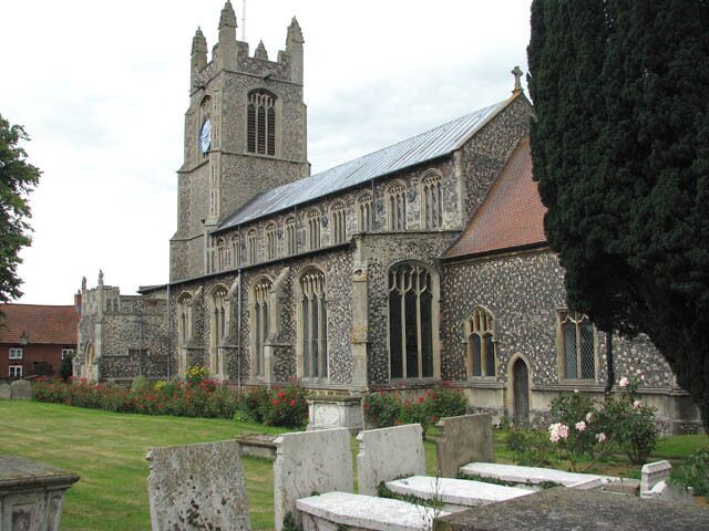 A historic church with a tall tower and arched windows.