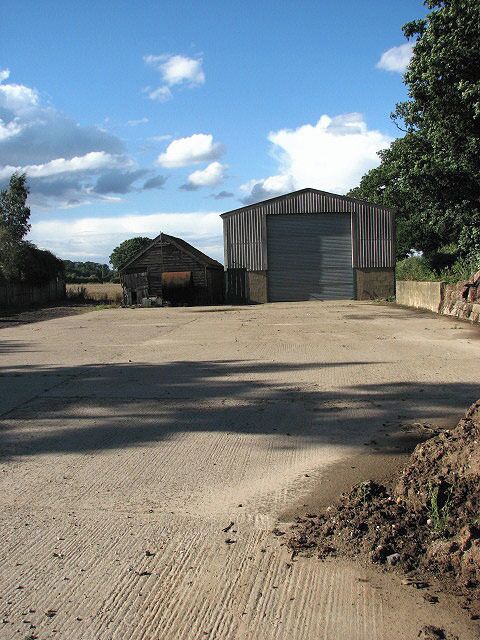 Old and new An old and a new shed standing side by side, by Smee Farm.