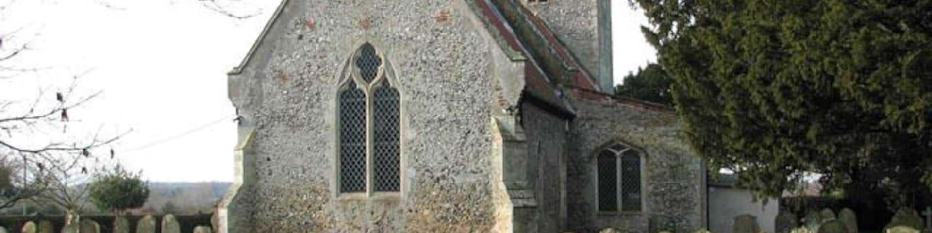 All Saints church. All Saints church > 1692081 - 1692114 dates from the 14th century and is a Grade II listed building. Its south porch is a later addition dating from the 15th or early 16th century, and an extension built onto the north wall and providing modern facilities was completed in 2009. The church houses a number of medieval survivals, amongst them several wall paintings - one depicting St Christopher, another the Annunciation > 1692151. A very rare depiction of a group of women surrounded by three devils, dominated by Titivallus - the Demon of Gossip - is painted on the north nave wall, clearly meant as a warning against gossiping. The rood screen > 1692117 is late C15. The octagonal font > 1692132 is of Purbeck marble and dates from Norman times, whereas the wooden painted cover was added in 1934.