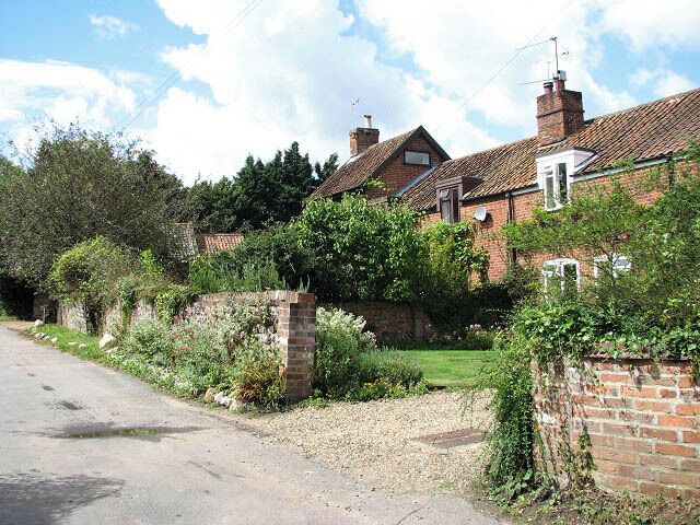 Red-brick cottages On Farm Hall Drive. Much of the village of Salhouse is now covered by a Conservation Order and it is hoped that its rural character will be maintained.