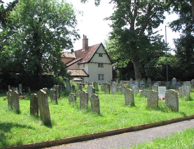 House adjoining churchyard. The house seen in the background is located on Ipswich Road (A140). It adjoins St Mary's > 1356351 churchyard in the south-west.