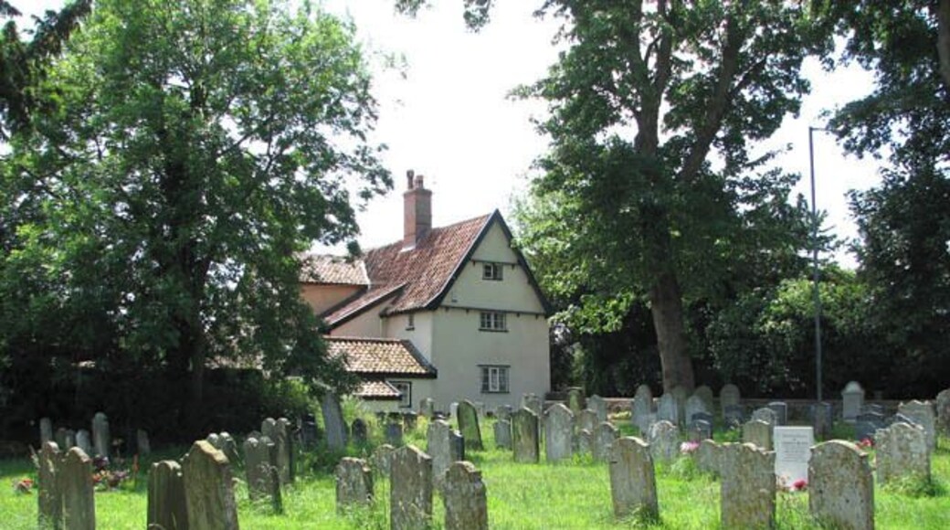House adjoining churchyard. The house seen in the background is located on Ipswich Road (A140). It adjoins St Mary's > 1356351 churchyard in the south-west.