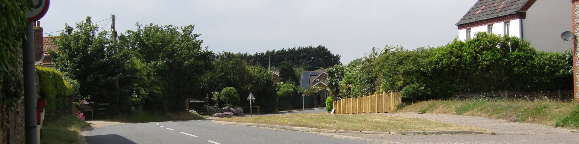 Looking westwards along Cromer Road in the village of Trimingham, Norfolk, United Kingdom.