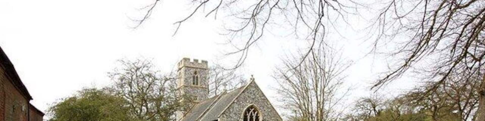 A church surrounded by a field of daffodils.