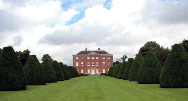 Salle Hall. For a view in the opposite direction see > 935166. Salle Hall was built in 1761 for Edward Hase; alterations were made in 1862, and east and west service blocks were added in 1910 for Sir Woolmer White. The east wing contains an Orangery. (N. Pevsner & B. Wilson, The Buildings of England, Norfolk 1: Norwich and North-East, 2002). Presently, Salle Hall and gardens are part of the Salle Park Estate, owned by Sir John White.