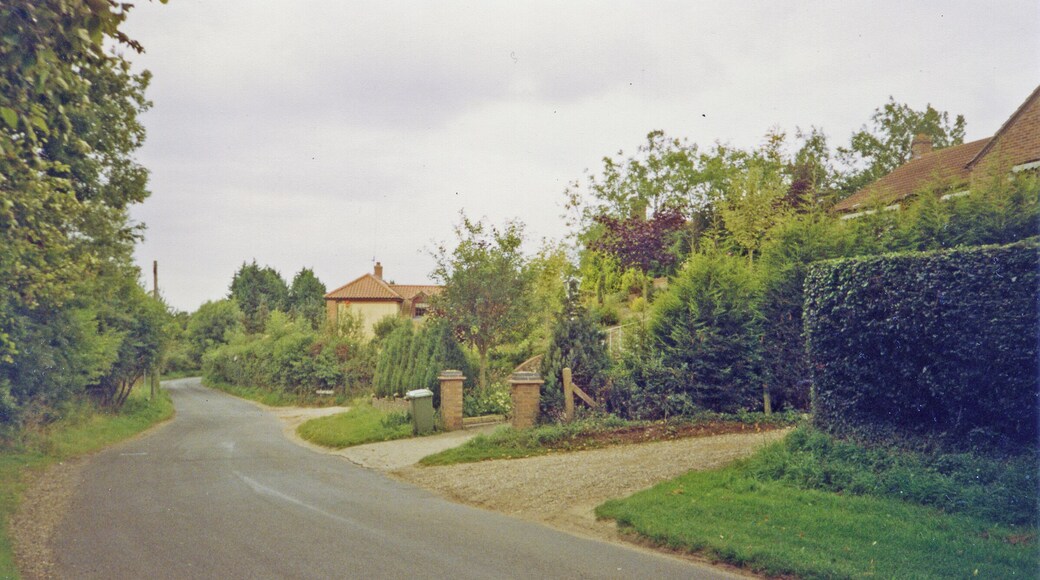Drayton (Norfolk): near site of station, 1993. View westward on Costessey Road by Station Road: the station had been up to the right and here the ex-Midland & Great Northern branch Melton Constable (left) - Norwich City (right) had crossed here - until 2/3/59 when almost all the M&GN system was closed wholesale.