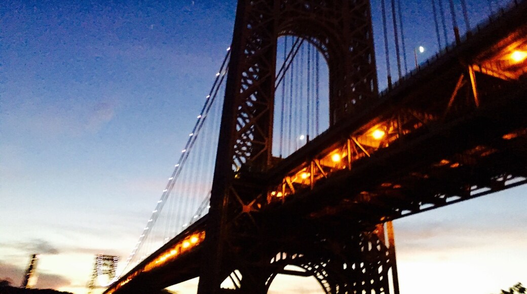 The beautiful George Washington bridge from southbound Highway 9A with a fleeting glimpse from the car sunroof shot on my iPhone! The azure sunset colors from the hurriedly darkening sky, the bright lights from New Jersey and the decked up bridge - it was magic!