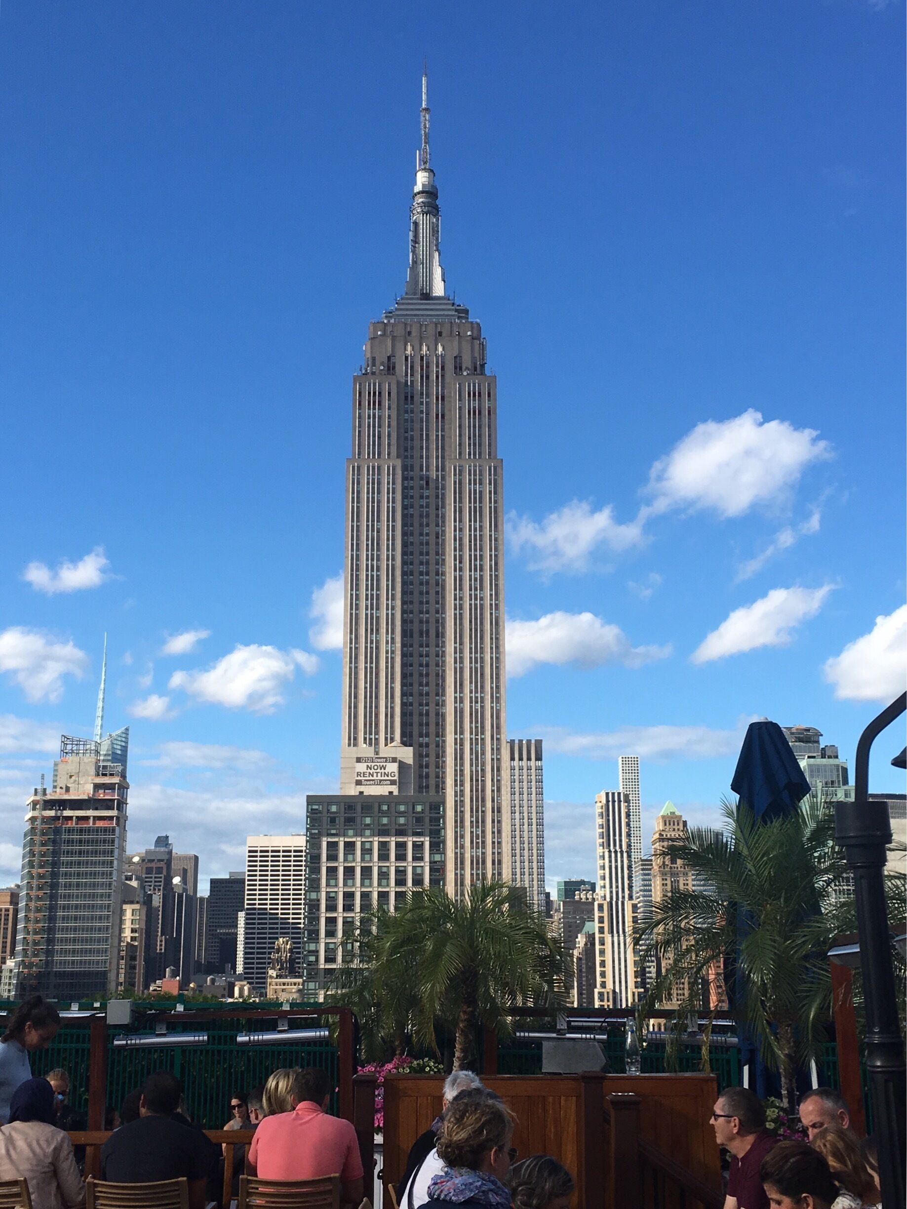 It's time for a cocktail on a rooftop facing the empire state building 