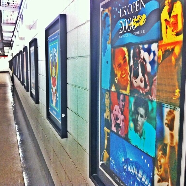Posters line the hallways of tournaments past inside Arthur Ashe Stadium.