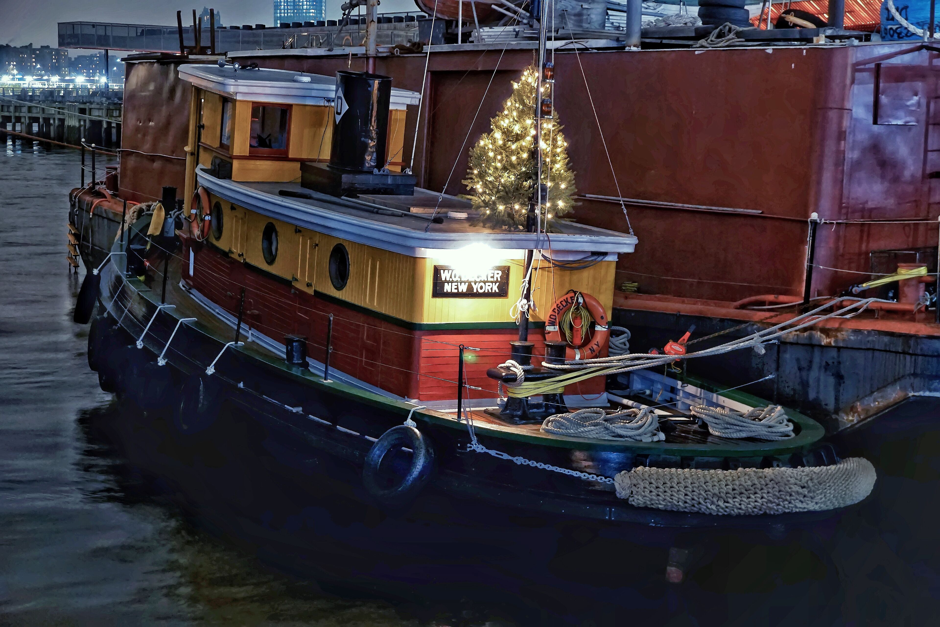 The last surviving, New York built, wooden steam tugboat (later refit with a diesel engine.) W.O. Decker was built in 1930 by the Newtown Creek Towing Company and originally named Russell I, after the towing company’s owners. She was renamed W.O. Decker in 1946 after being sold to the Decker family’s Staten Island tugboat firm. The tugboat was donated to the Seaport Museum in 1986, and was refit with a diesel engine. Decker is listed on the National Register of Historic Places and is an exemplary model of the types of steam tugs that were once an abundant sight in New York Harbor. This unique vessel is a true testament to New York City’s maritime heritage, which is a direct factor in the city’s global prominence today. Putting a Christmas tree up on this boat is a very nice touch.