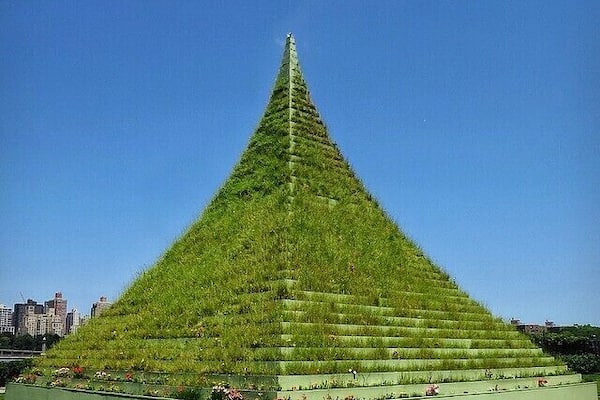 The Living Pyramid by Agnes Denes at the Socrates Sculpture park in Long Island City with the Manhattan skyline in the background
