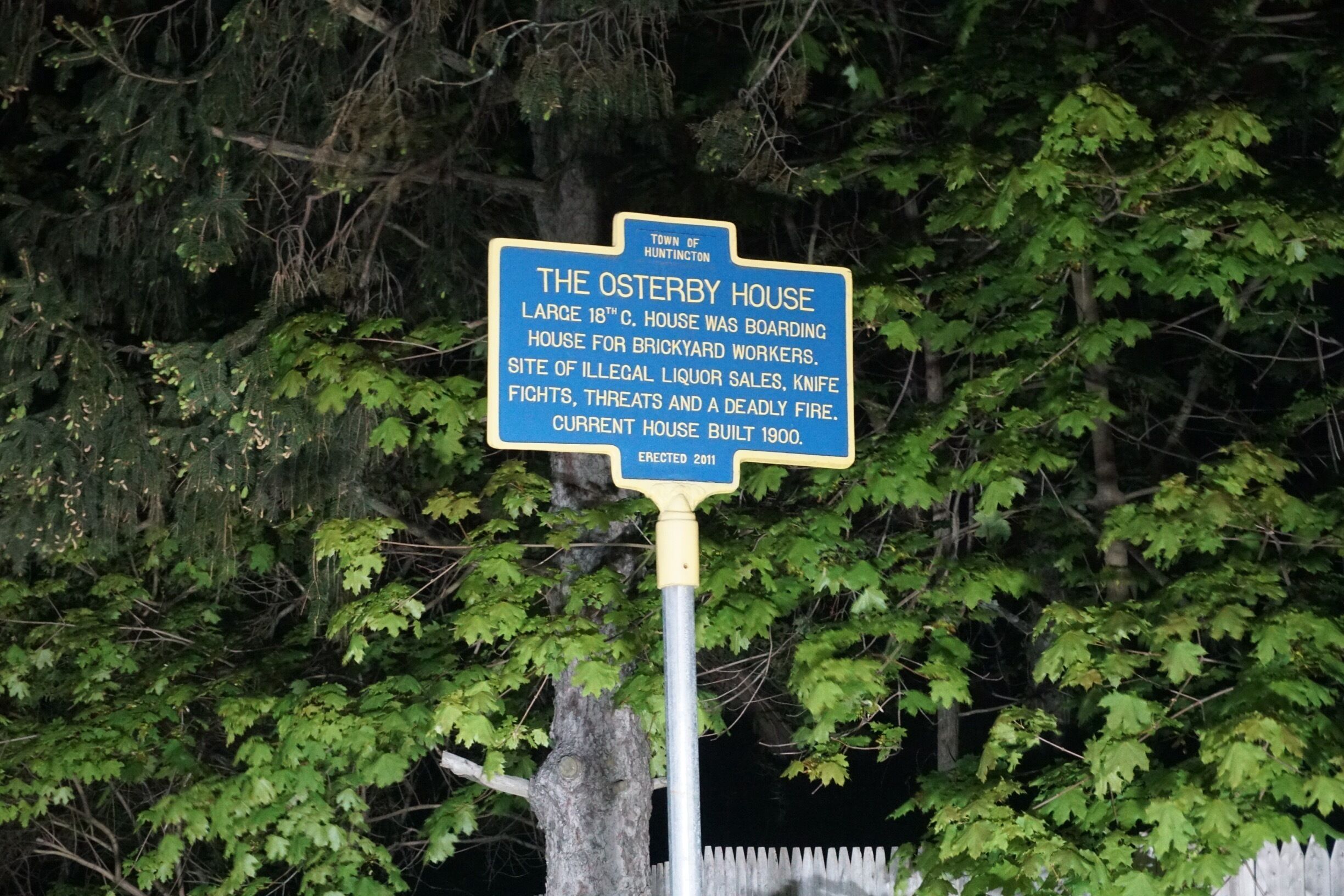 A historical marker sign about The Osterby House, detailing its history and current status.