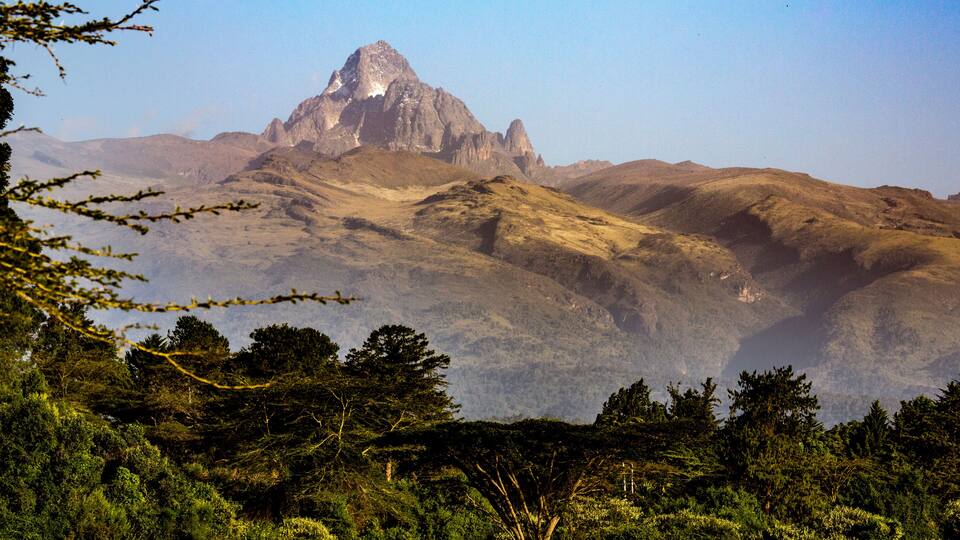Dramatic view of Mount Keynya with the mist rising from forest below in Nyeri County, near Nanyuki; Kenya, Africa