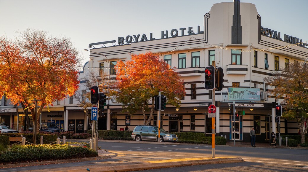 Orange featuring heritage elements, a small town or village and a sunset