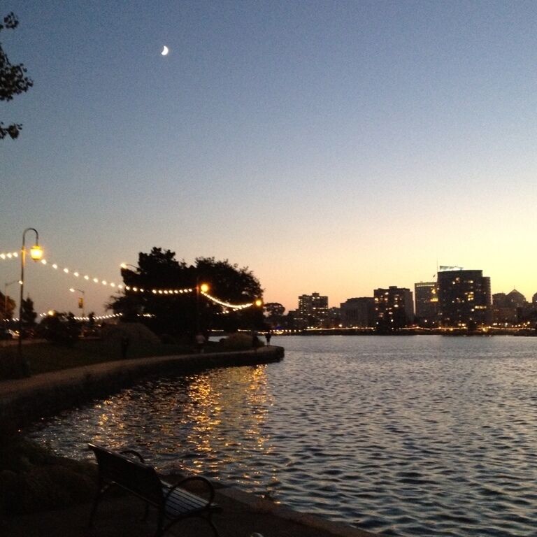 Nice sidewalk lined with lights going around the perimeter of the lake 