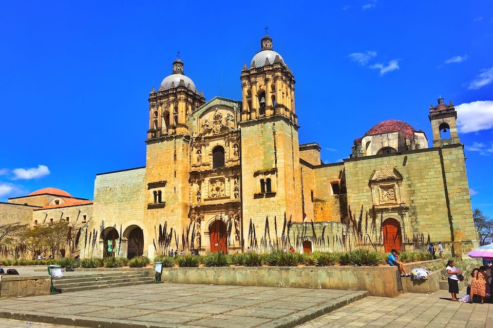 A historic cathedral with two prominent towers and a large dome.