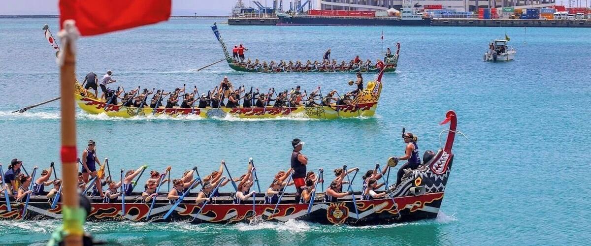 45th Naha Dragon Boat Festival in Okinawa, Japan. Each boat weighs 2,500lbs with 32 paddlers, drummer, coach m, and 2 kajitoris to steer the boat. #Adventure #okinawa #japan