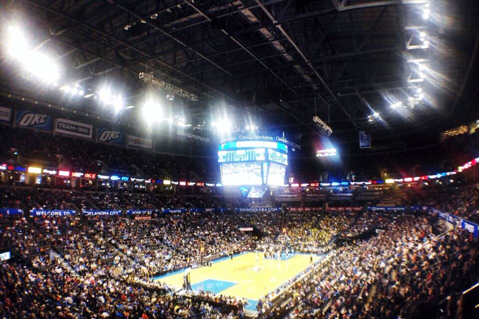 A basketball arena filled with spectators.
