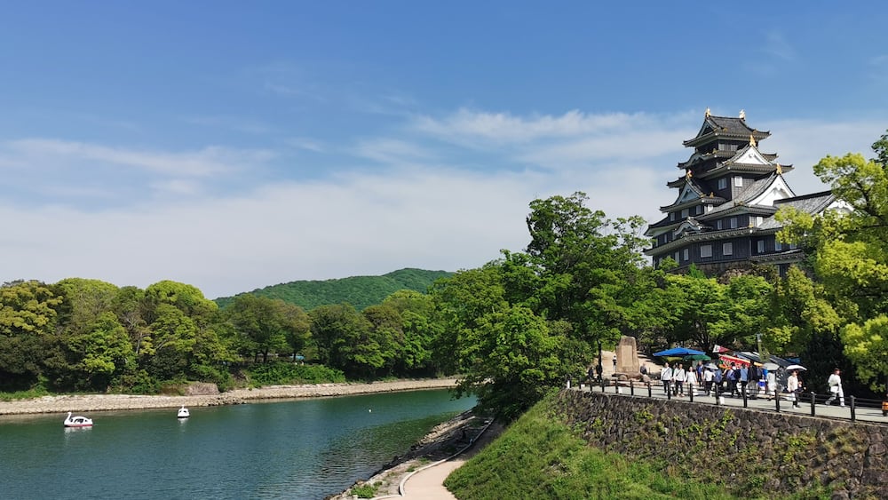 Okayama Castle against the clear blue skies..