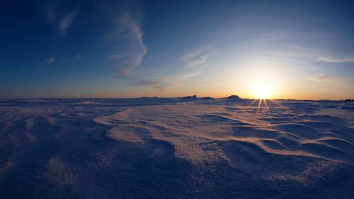 Nome featuring a sunset and snow