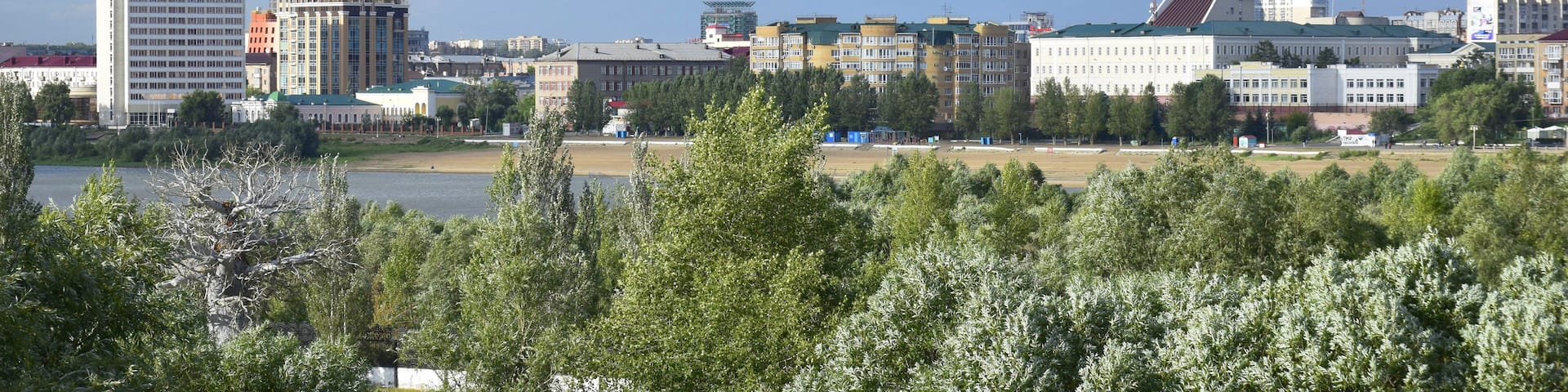 View of the embankment and the historical part of the city of Omsk in Russia from the Leningrad bridge on the Irtysh river-7