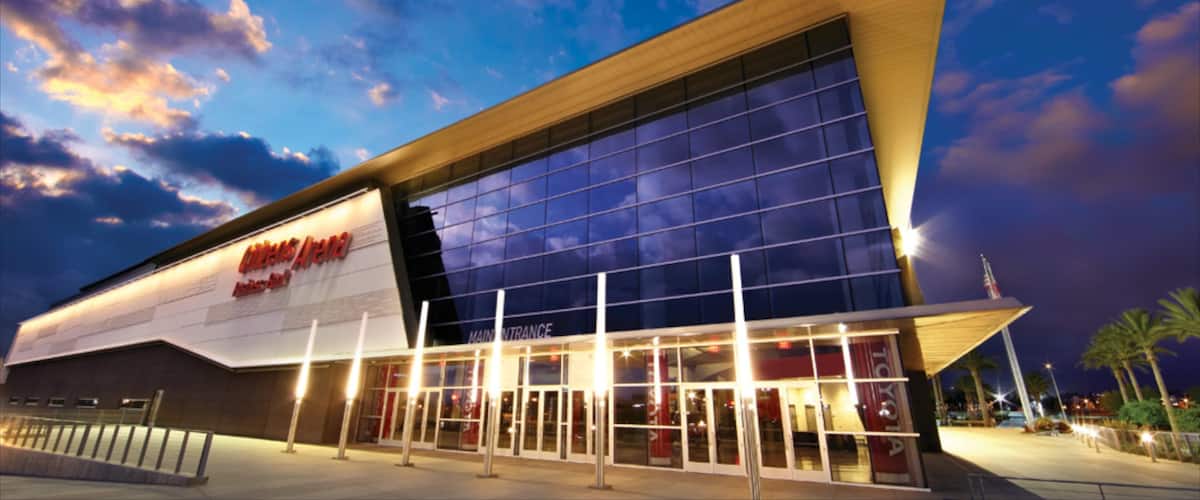 A modern building with a large glass facade and a prominent Toyota sign.