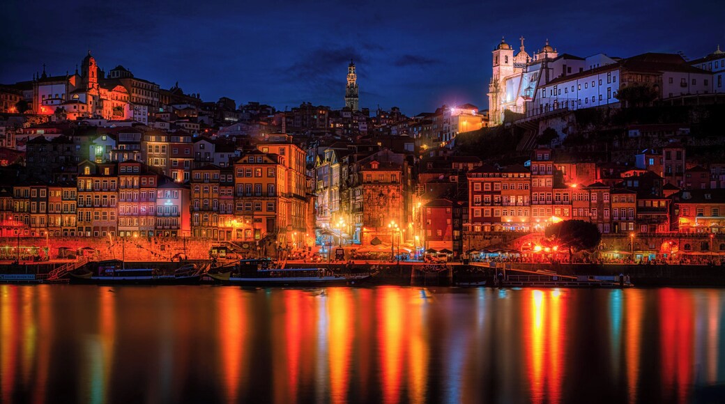 Beautiful warm sunset from Porto in Portugal overlooking the old town harbour with the view over the Douro river.