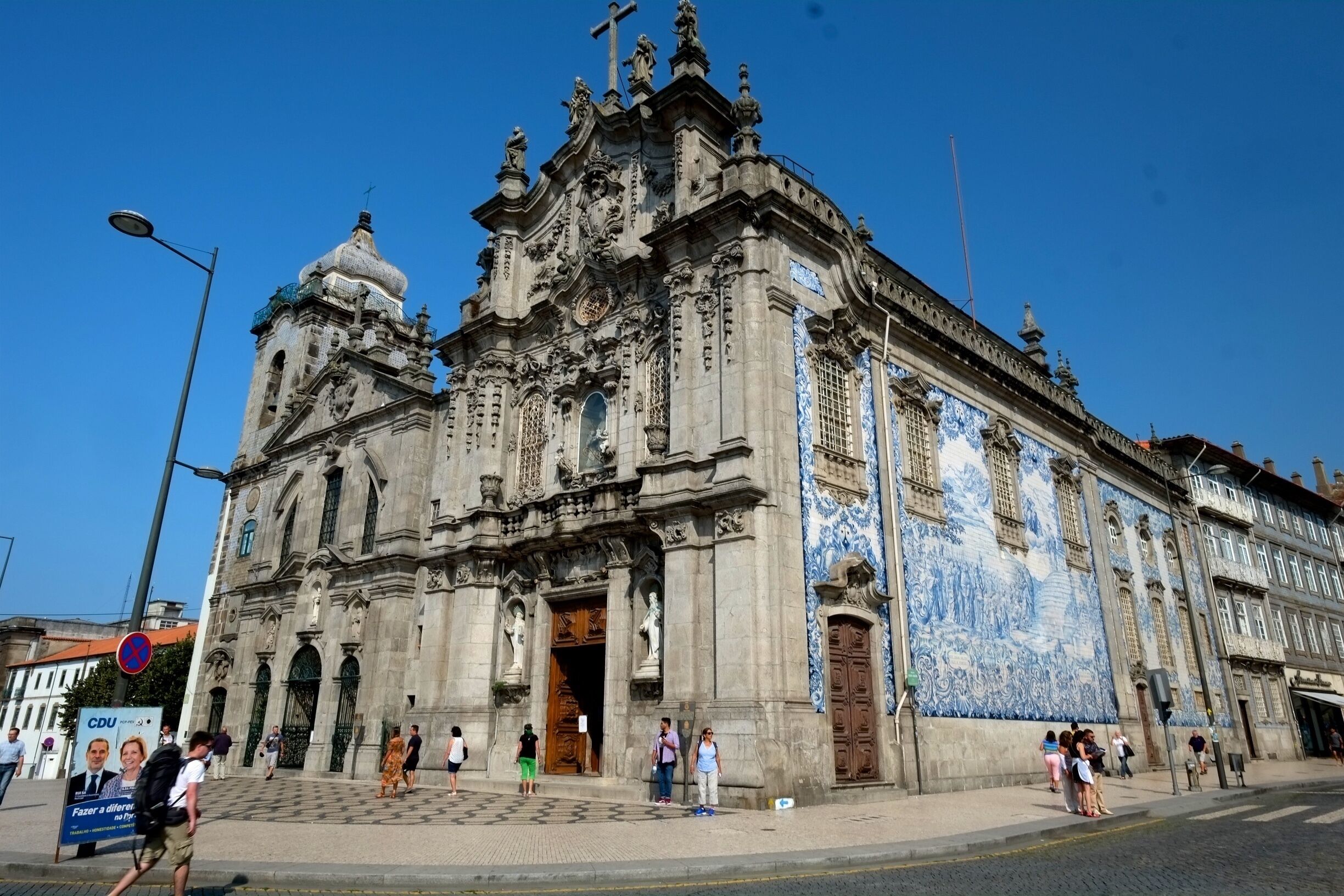 Connected to its twin church by a house, this baroque church has a well-known tiled side facade.
