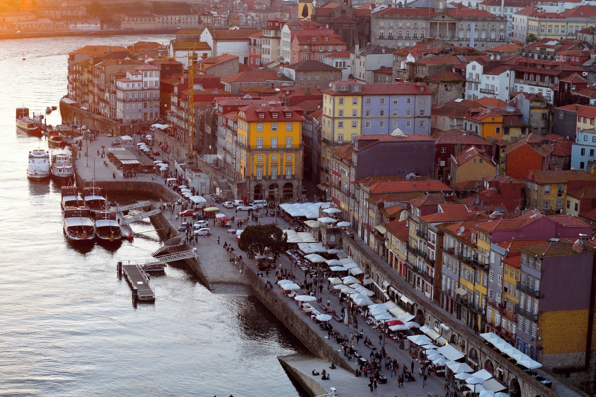 View of Porto's Riberia from Dom Luis I Bridge at sunset. 