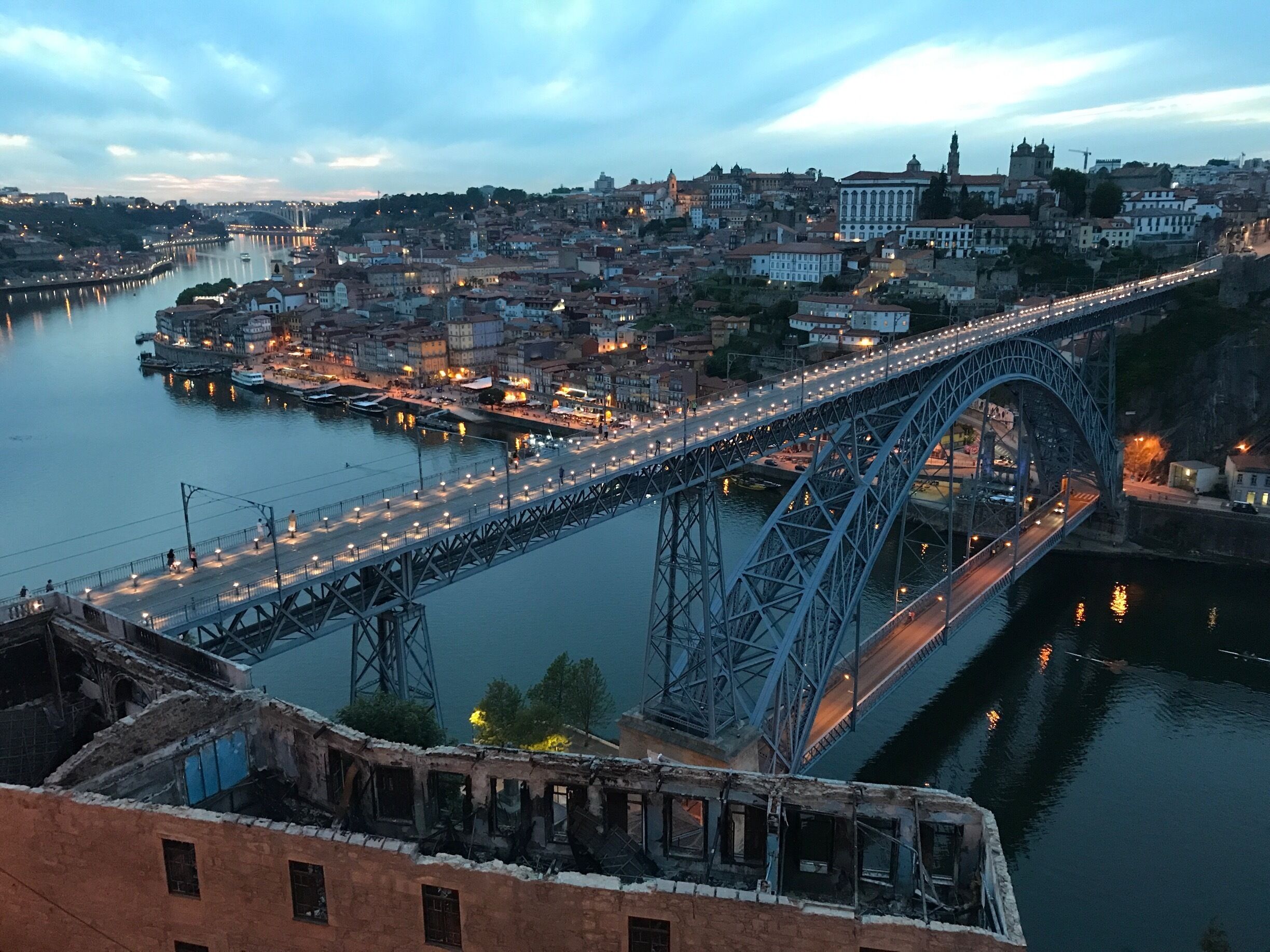 This was taken on a monument above the bridge in Vila da Gaia overlooking Porto, the Douro river, and the Ribera. It is a popular spot so If you want a good pic arrive early and go to the far right corner. This is one of the best spots to watch the sunset or look over Porto at night. 