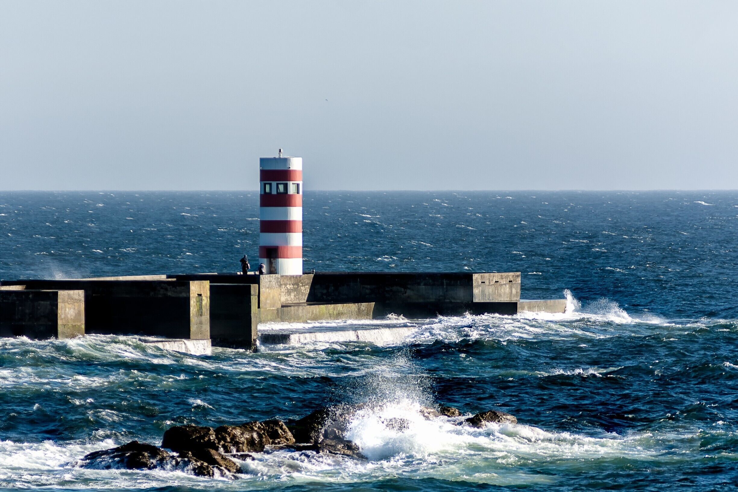 Last Year I visited the Portugees town of Vizela for a #Cittaslow conference. At one evening we went to visit Porto. We drove along the coast were a shot the lighthouse at Jardim do Passeio Alegre. It was windy this day as you can see at the waves. 
Porto btw is a very beautiful city at the ocean. I will be back one day.

#portugal #porto #lighthouse #ocean #landmark #red #rocks #waves
