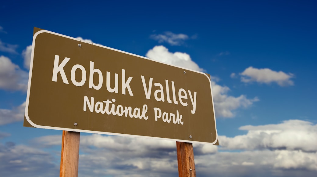 Kobuk Valley National Park (Alaska) Road Sign Against Blue Sky and Clouds.