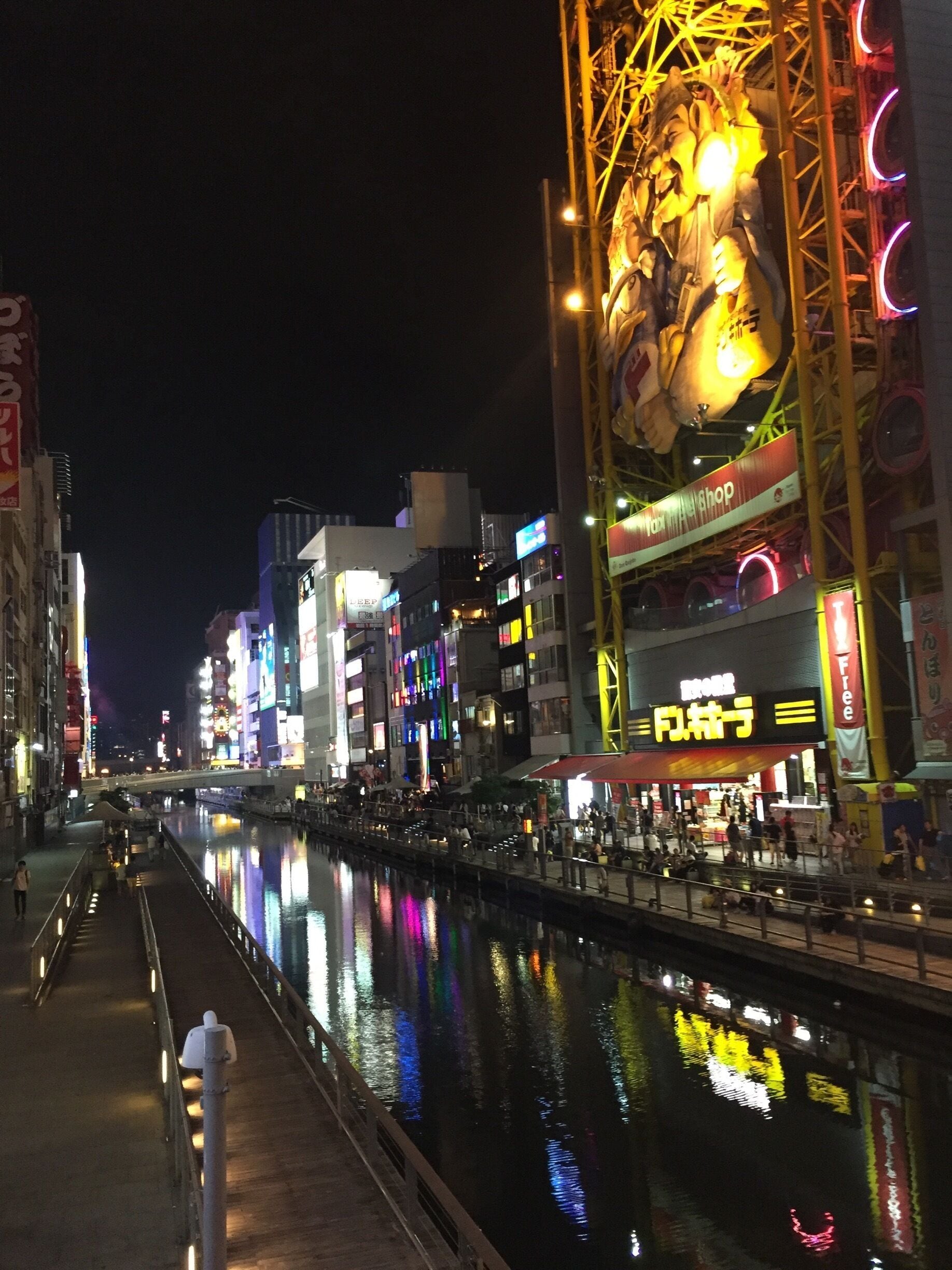 That's a Ferris wheel on top of the Don Quijote store. Go into the store and experience a visual  overload of products stacked from the bottom to top and occupying well over five floors. 

When you hit a certain price point and beyond as a tourist you can make your items tax free by showing your passport. 

Also they play their theme song on loop. 
