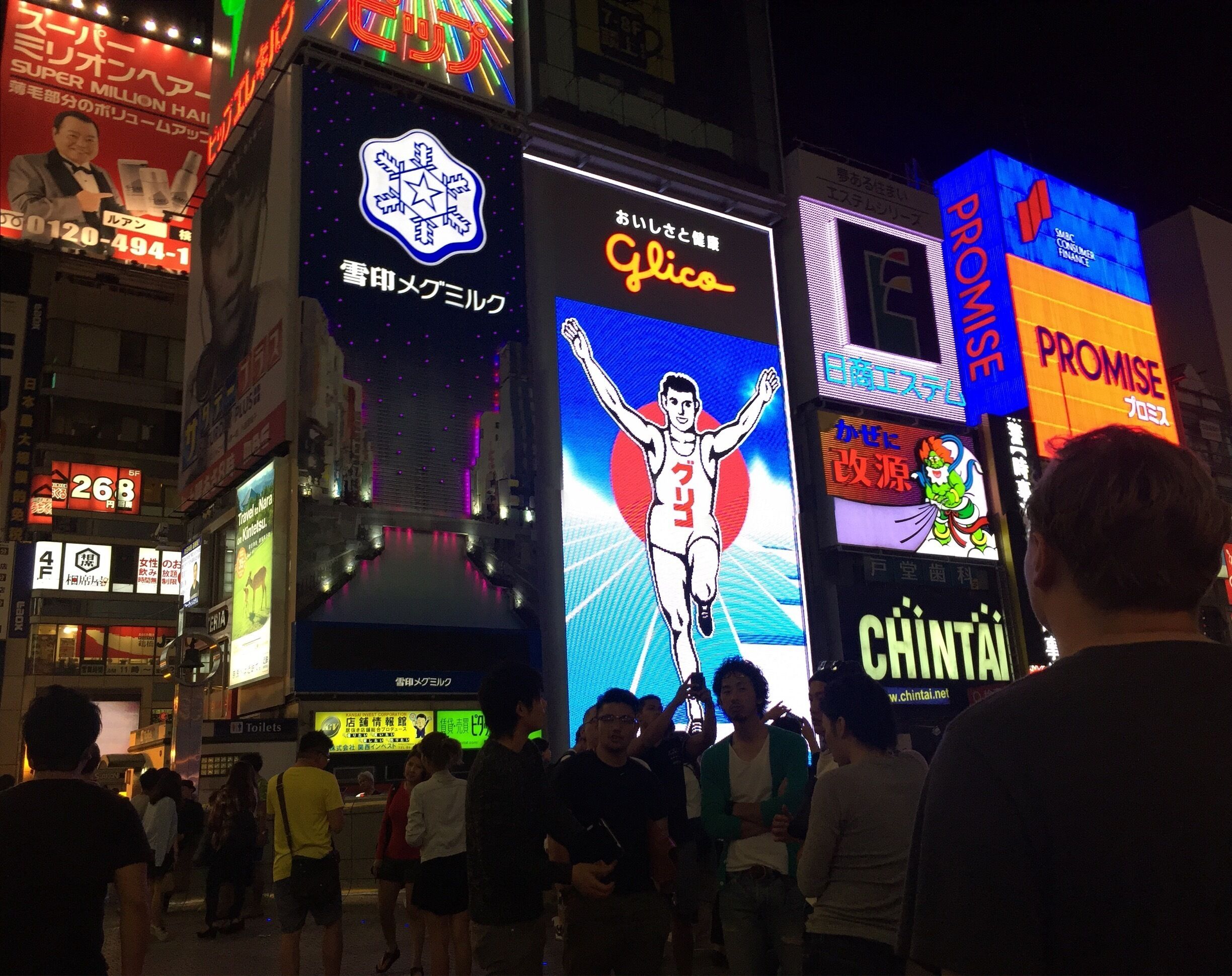 Outside of H&M is the Glico board. It lights up blue and orange at night.