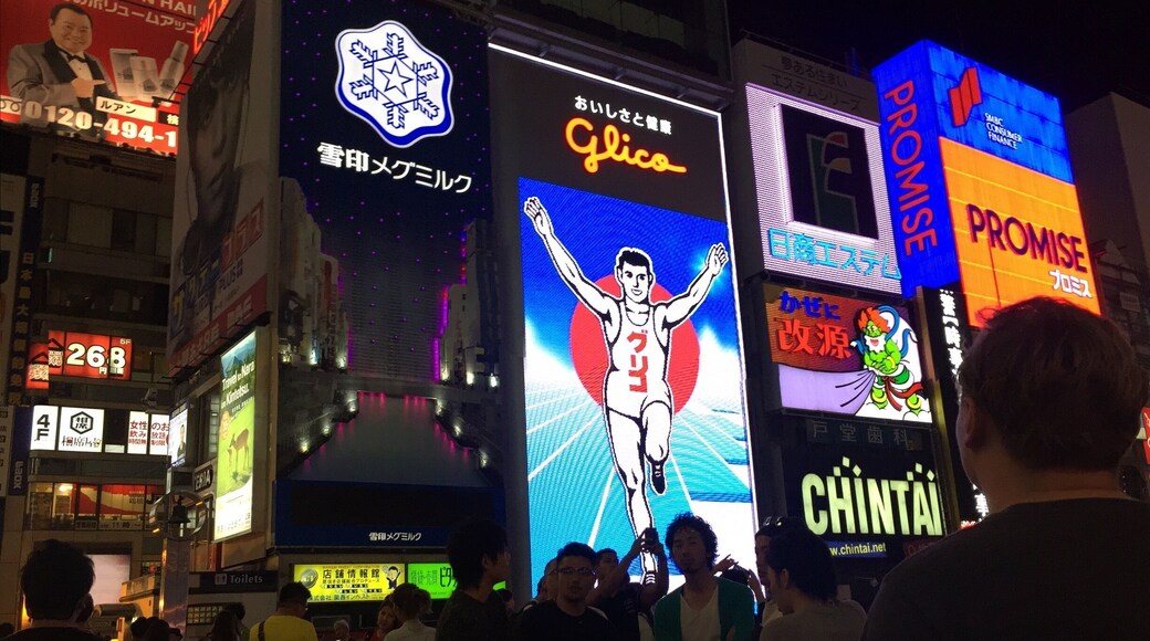 Outside of H&M is the Glico board. It lights up blue and orange at night.