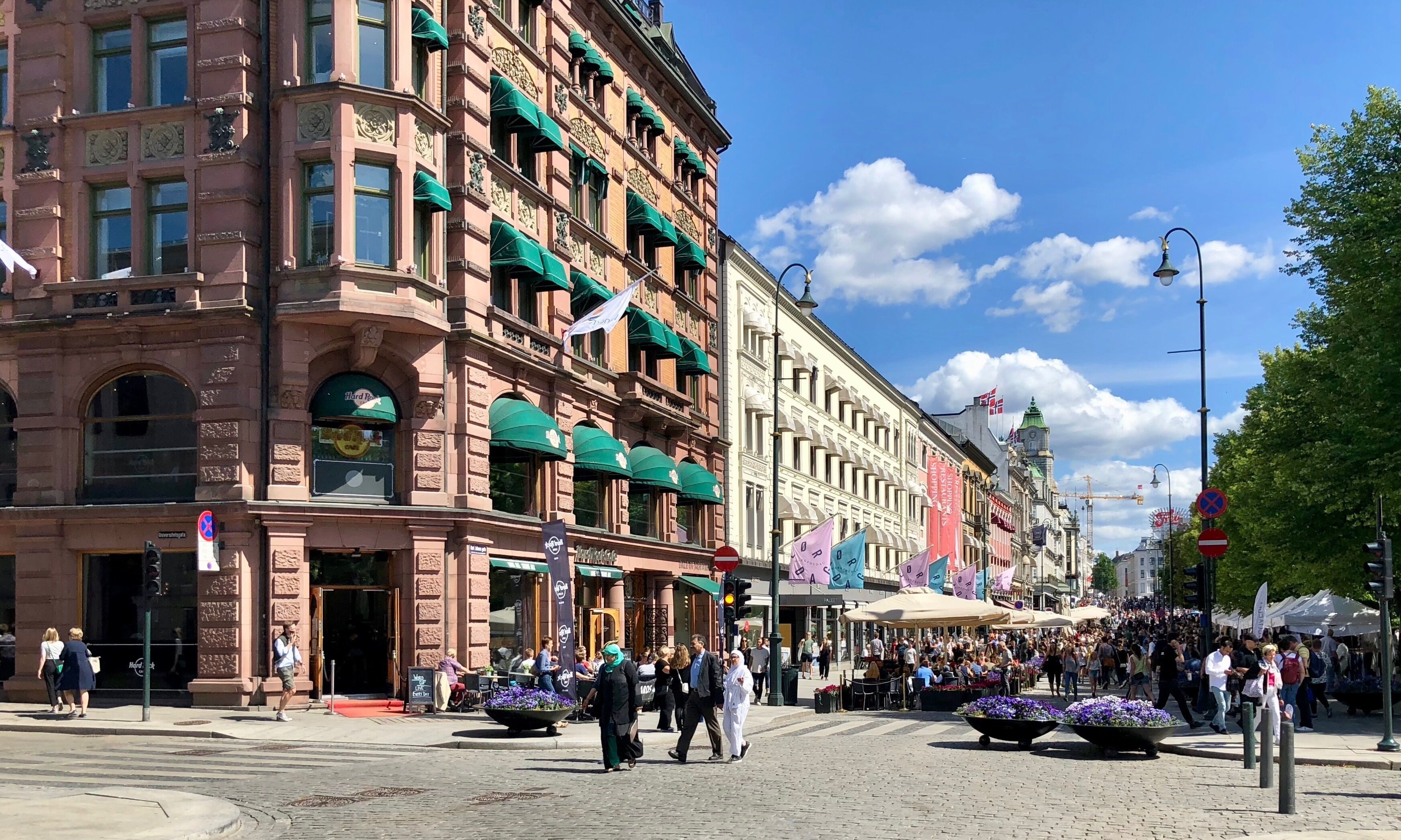 Karl Johans Gate, in the city of Oslo, Norway, is the main street and Oslo's most famous, which stretches from the Royal Palace to Oslo Central Station. There are shops of all kinds and street artists during summer. Park and pedestrian walkway alongside the street. 

#street #markets #Oslo #Norway #OnTheRoad