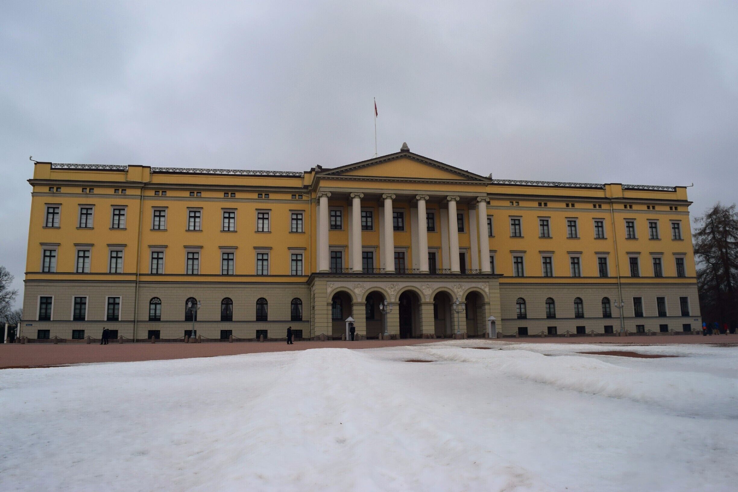 The Royal Palace in Oslo, Norway. The current Norwegian monarch still lives here! 

Close to the Nationaltheatret train station. Free to see. They do guided tours in Norsk and English in the summer only, $10 per tour. 