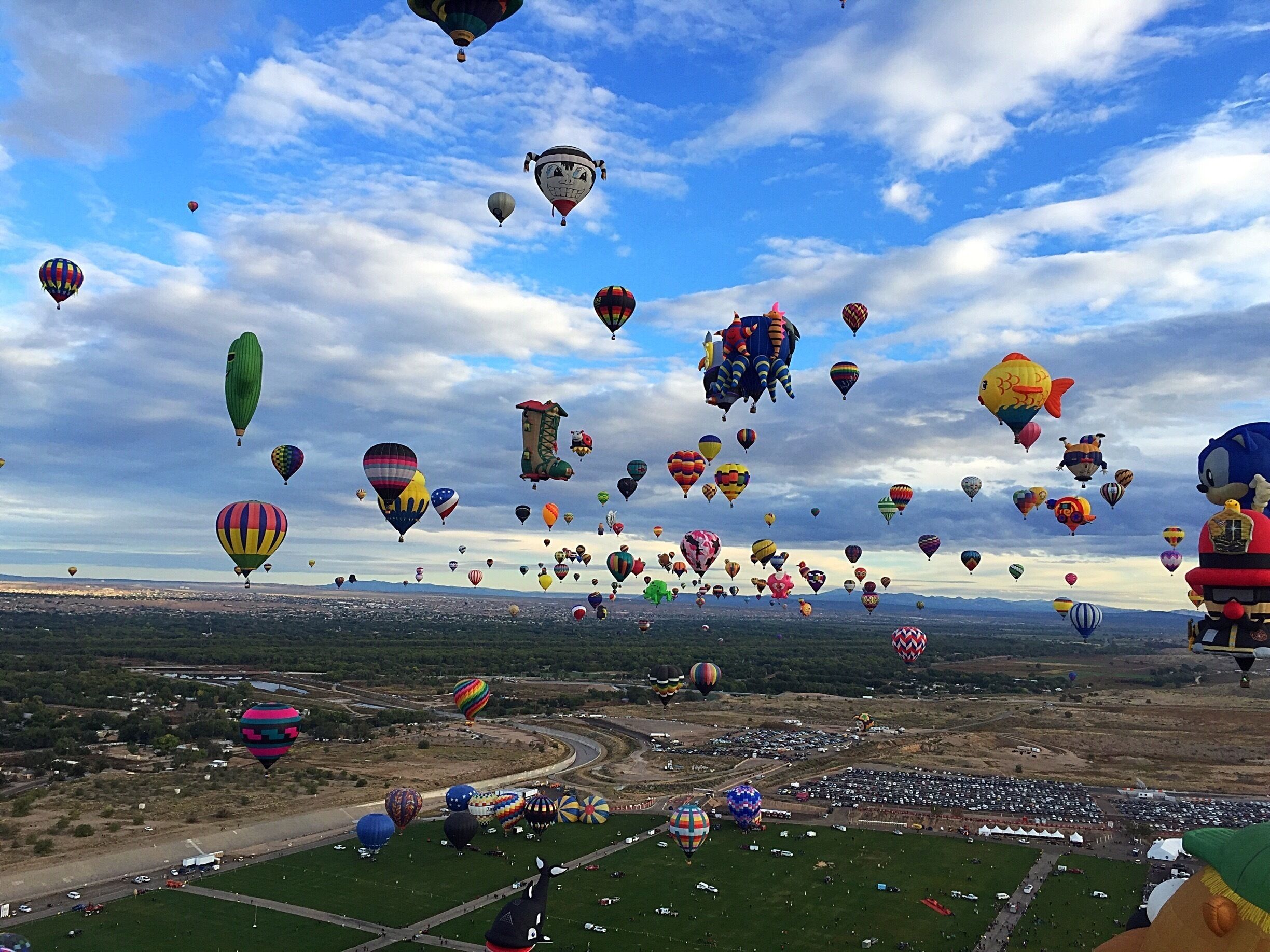 Hundreds of balloons for the hot air balloon fiesta in Albuquerque. My view from one of them. #visitabq #balloonfiesta #beautifulcolors #amazingviews #blue