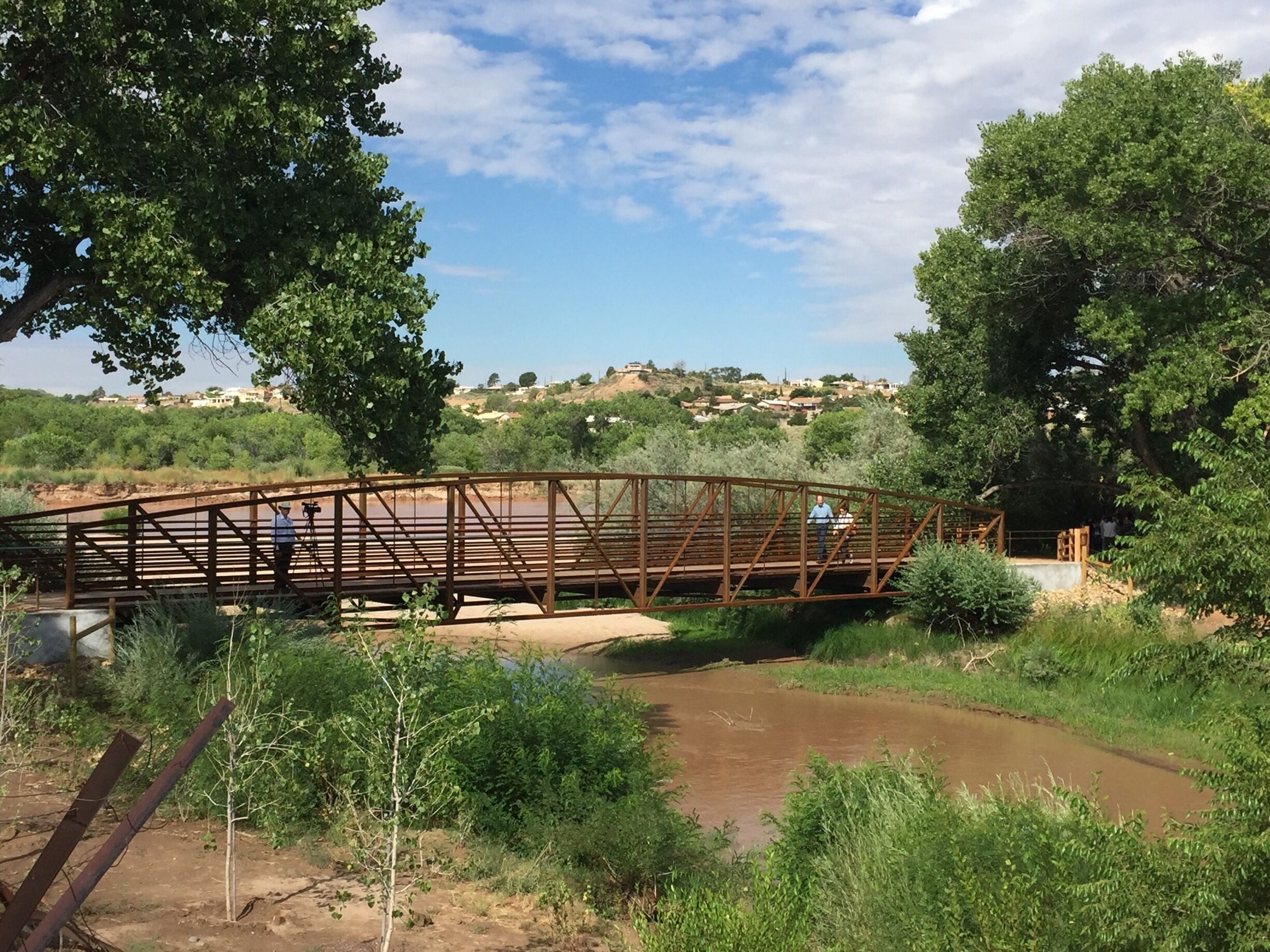 The bosque riverside trail, recently upgraded to a 5-foot wide path of crusher fine to make it fully accessible, includes the addition of this lovely new bridge. Mayor Richard Berry crosses it with his publicist following the grand opening ceremony, August 2017 
