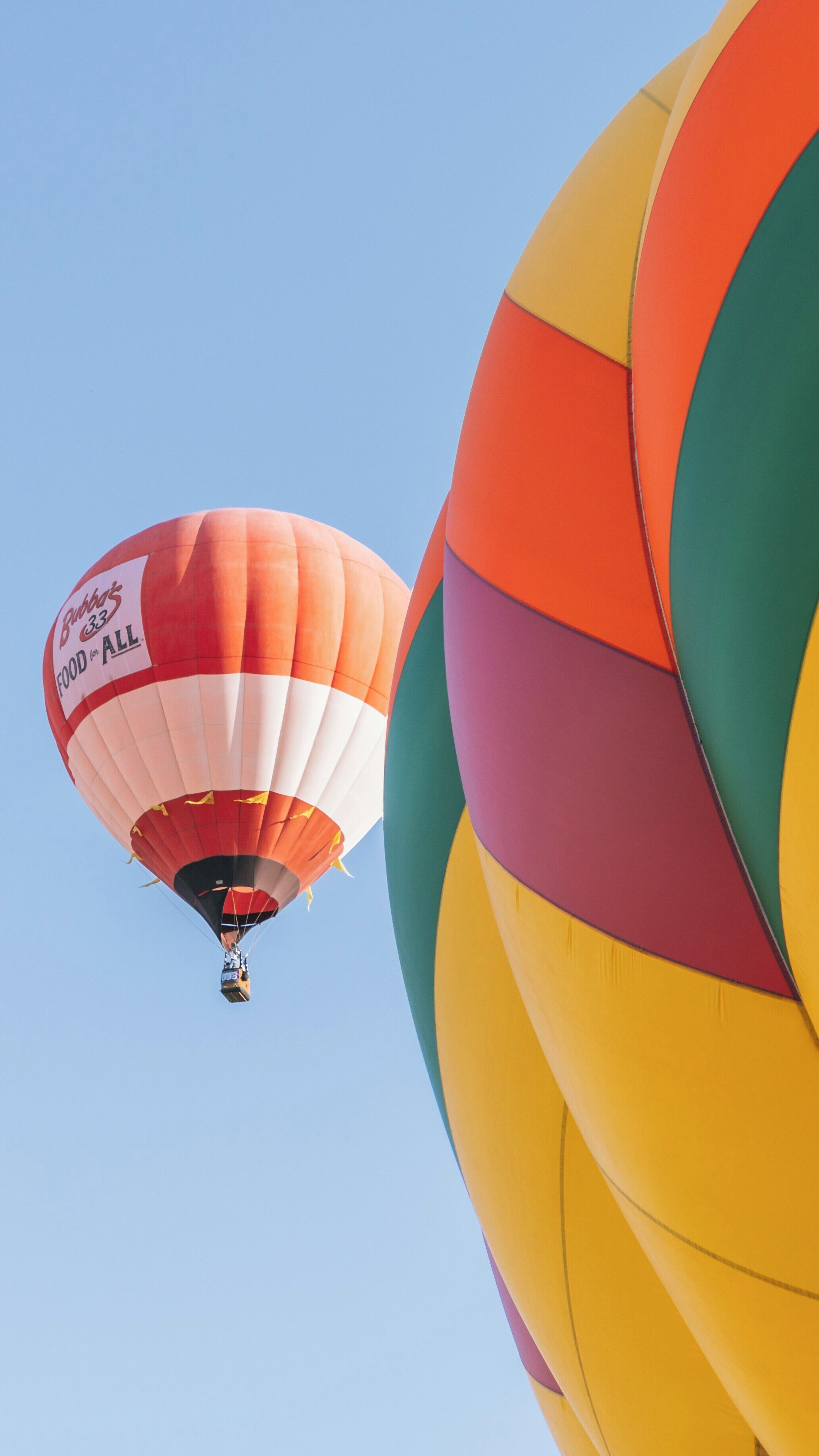 Hot air balloons soar high over Balloon Fiesta Park in Albuquerque, New Mexico during the annual festival