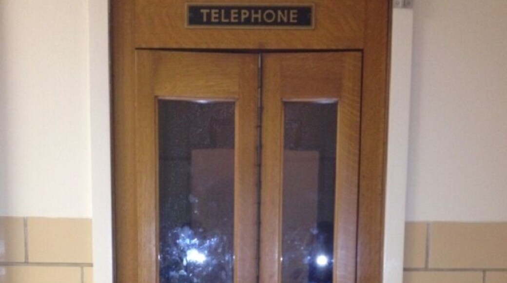 Old-school phone booth in Northrop Hall. The phone has been removed, but a stool remains inside and the doors still open & shut to give one a quiet box in which he or she may find a modicum of momentary privacy.