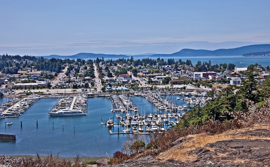 This is an aerial landscape of Anacortes Washington, overlooking the marina. Puget Sound and the San Juan Islands are in the distance. Small coastal town in Skagit County, Washington state.; Shutte